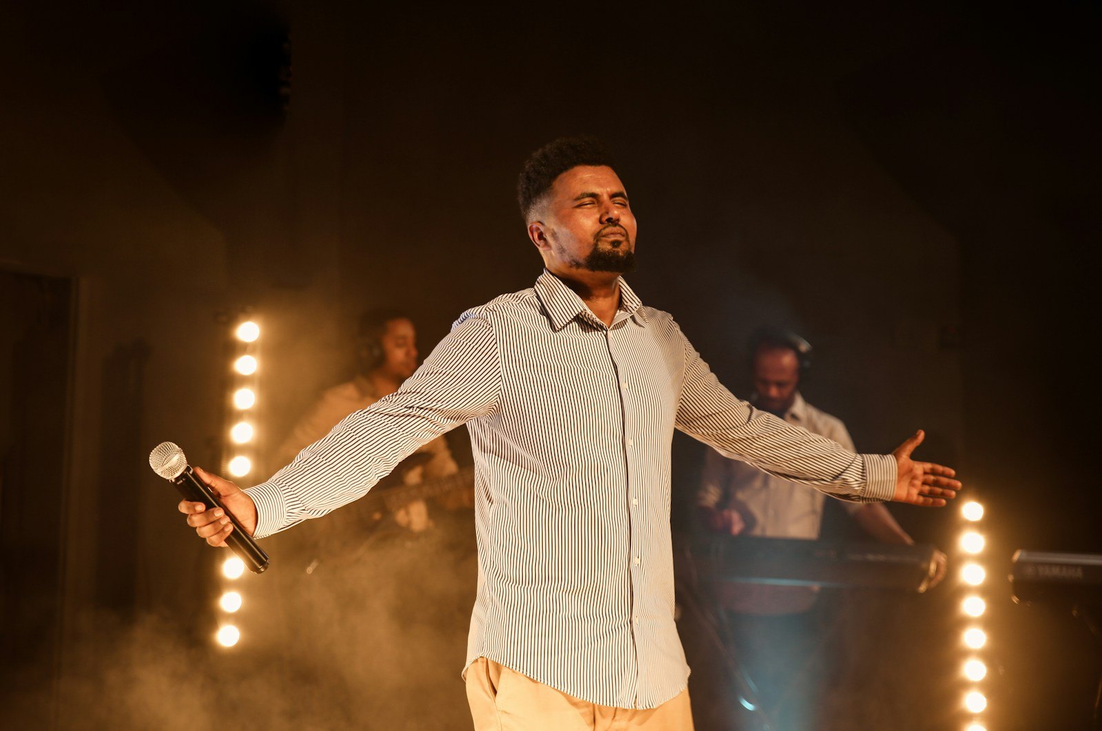 A comedian on stage with a microphone