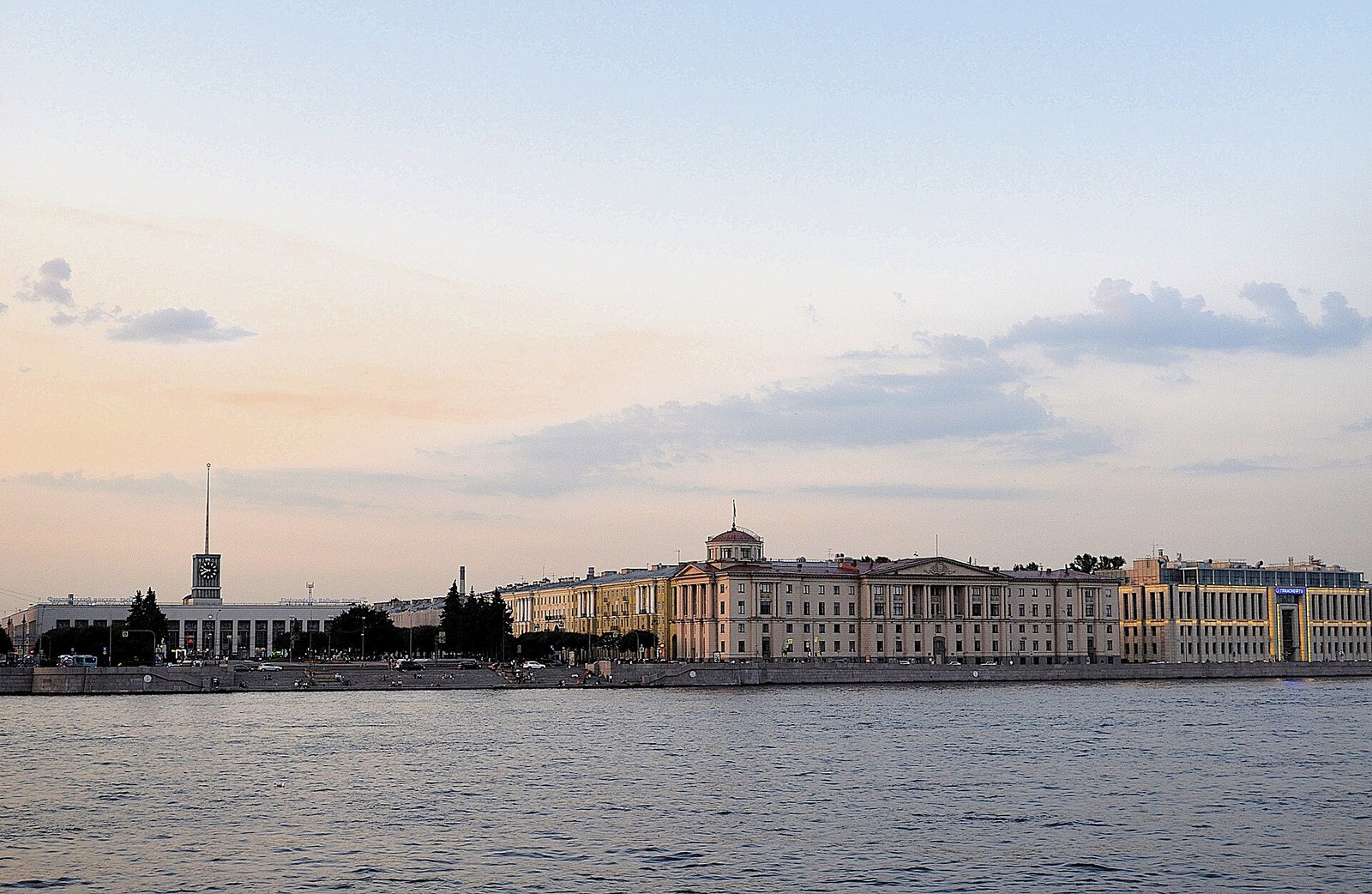 The Arsenalnaya Embankment and the Finlyandsky station tower across the Neva at sunset