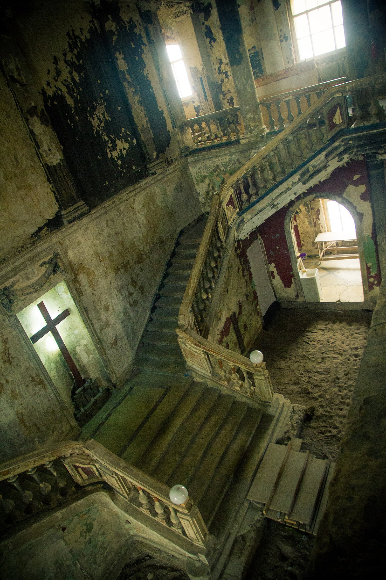 The hall of Annenkirche: fire-scarred walls, staircases and galleries