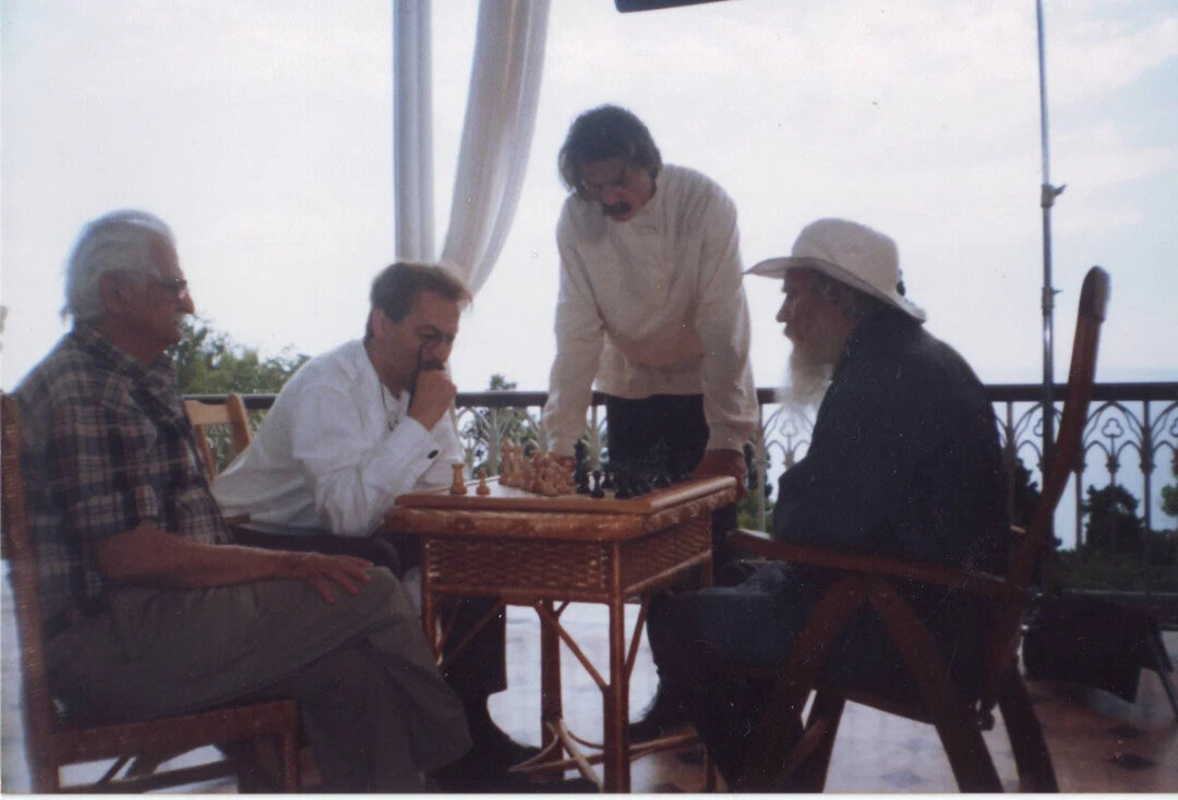 On the set of Nevechernyaya: actors made up as Tolstoy and Chekhov at a chessboard
